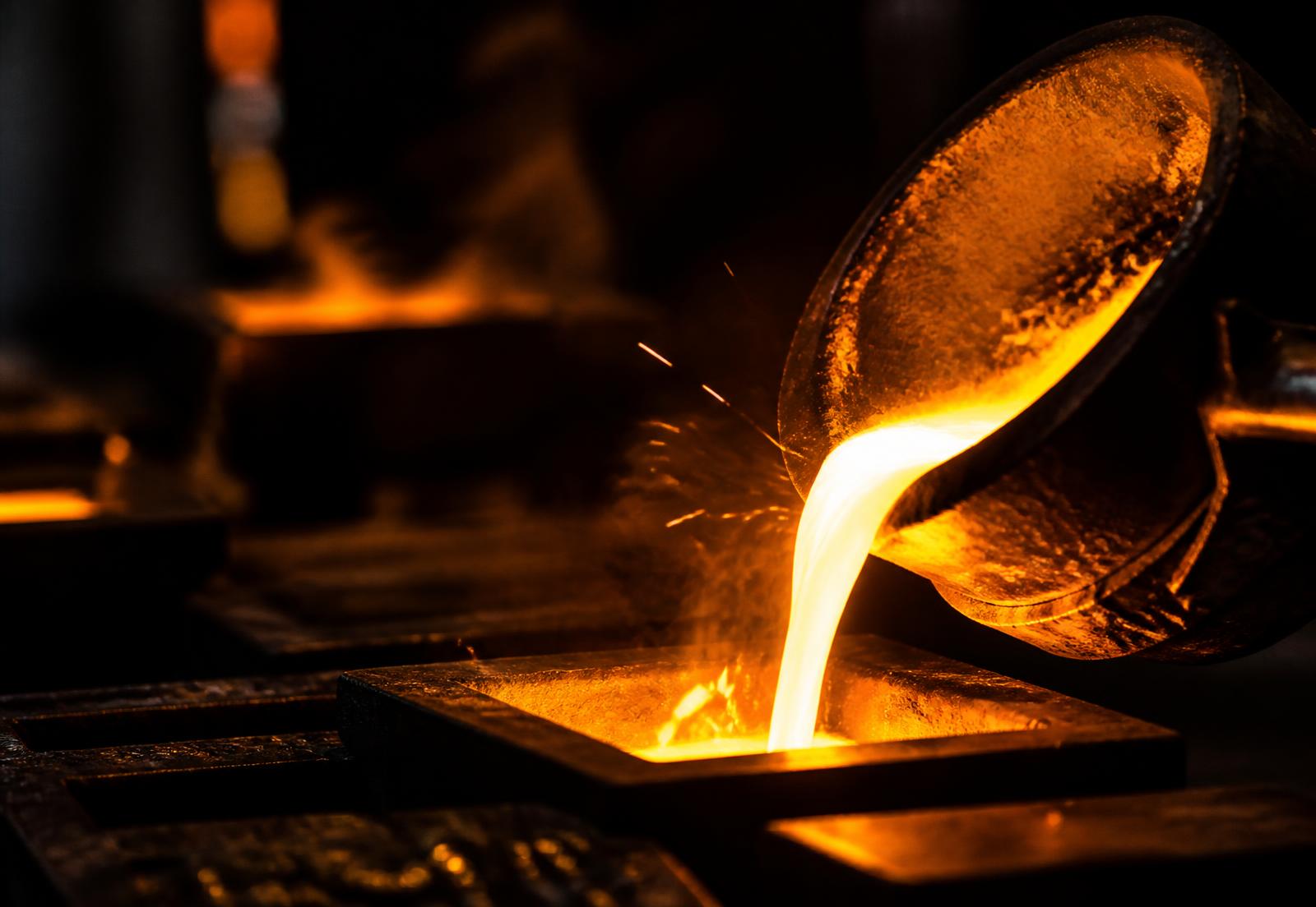 Molten gold being poured into a mould at the Larzorite refinery